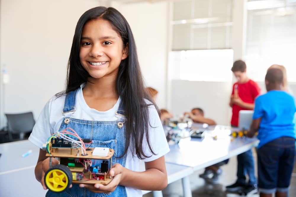 Portrait,Of,Female,Student,Building,Robot,Vehicle,In,After,School